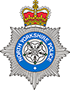 North Yorkshire Police logo. There is a golden crown sat atop a silver seven-pointed star. The words 'North Yorkshire Police are in white on a blue circle on top of the shield.